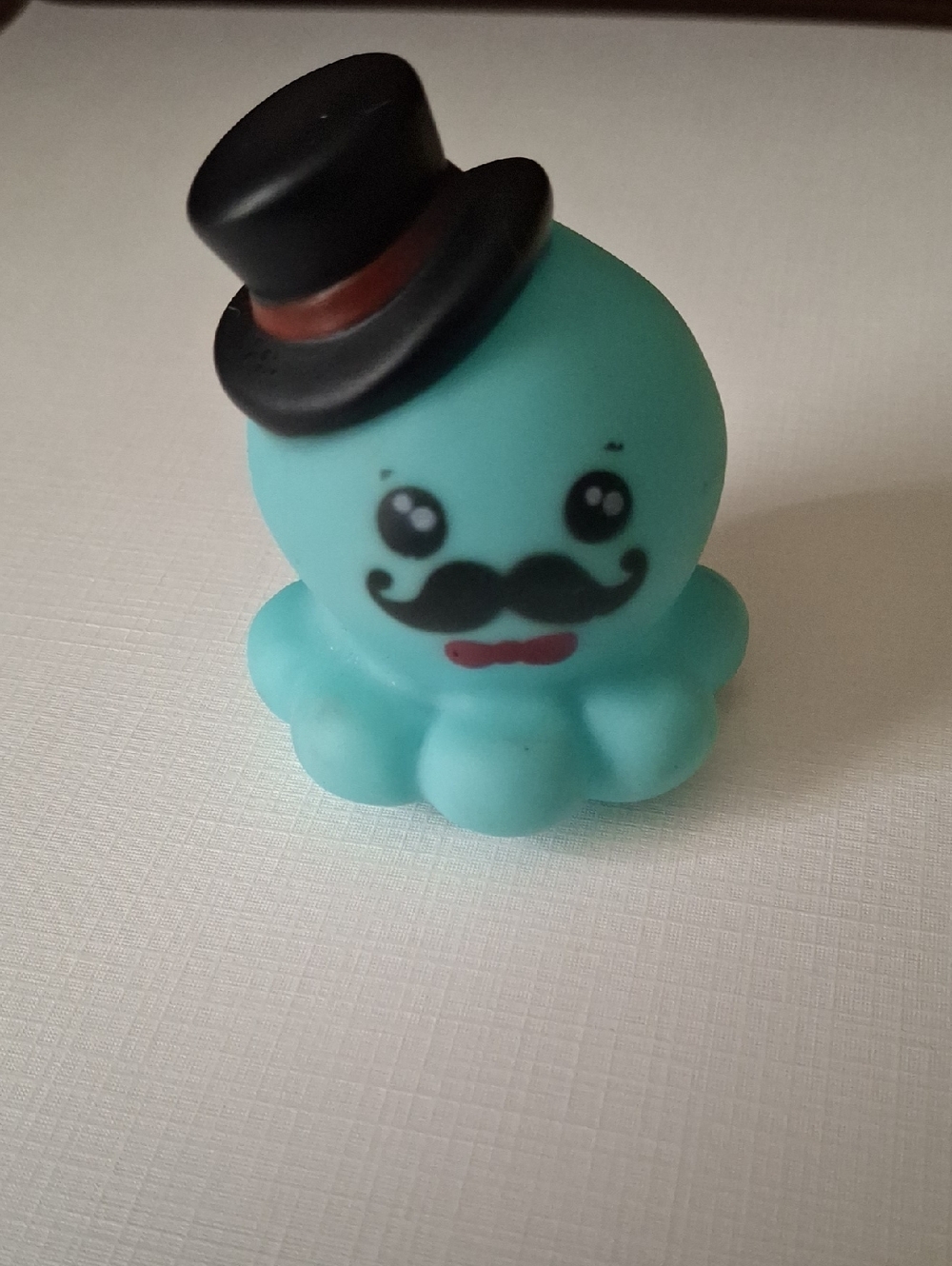 Adorable Teal Octopus Figure with Black Top Hat